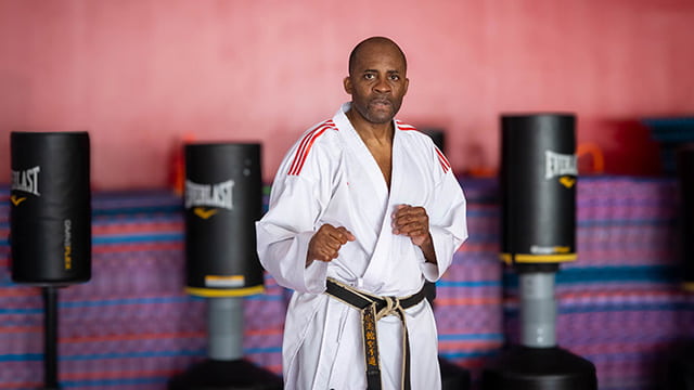 Sensei Alex Ndem in karate pose.